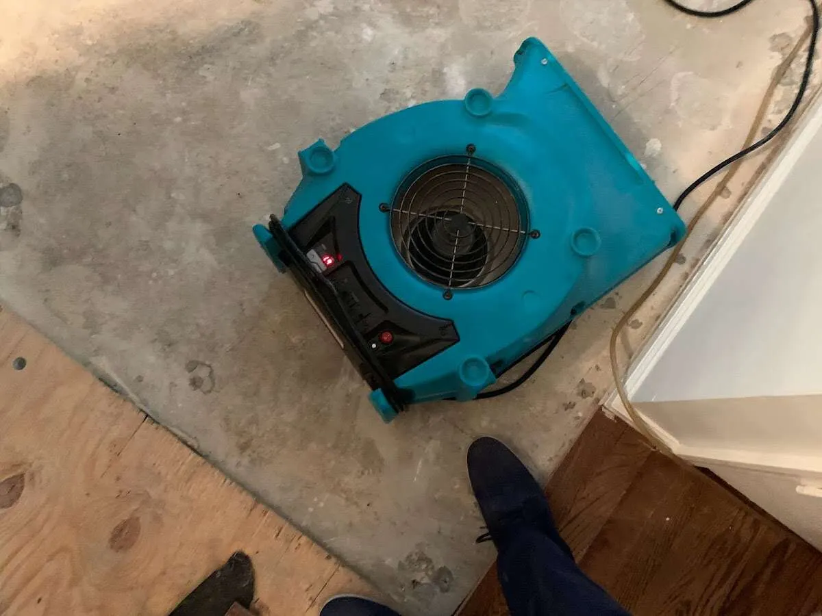 Air mover drying subfloor during Leak Detection & Repair in North Salem